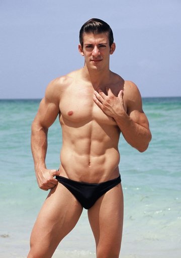 Sexy Zack Johnathan shows off his body on the beach