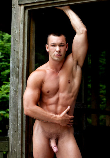 Hot muscle hunk shows his shaved cock outdoors